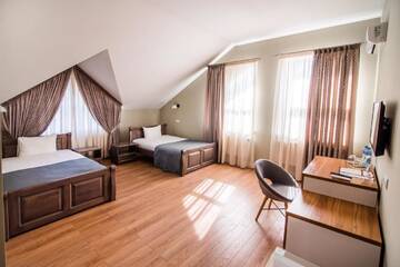 Фото номера Двухместный номер с 2 отдельными кроватями Отель Gosudar Hotel г. Кропивницкий 4
